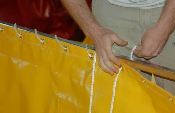 Liners are attached to frames with rope through grommets, which is wrapped around the frame to keep it secure