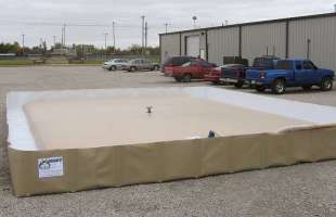 A husky bladder tank sitting inside a husky berm for extra spill protection