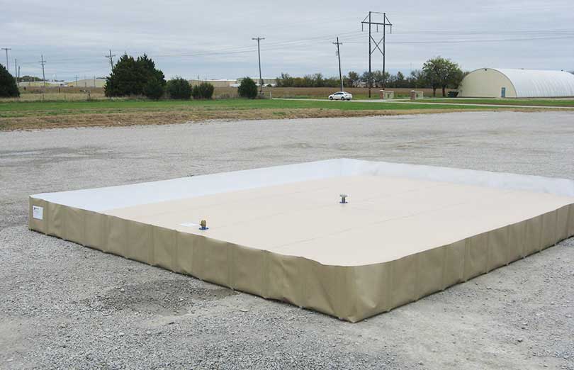A husky bladder tank sitting inside a husky berm for extra spill protection