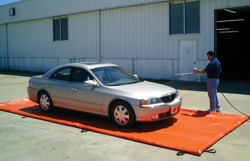 Husky Eagle Berms can be driven on for easy containment when washing vehicles