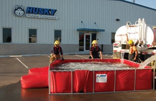 Firefighters filling and setting up a PRO500 tank