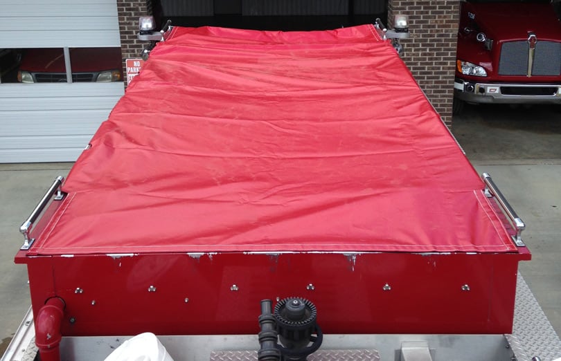 Firefighting hose bed cover