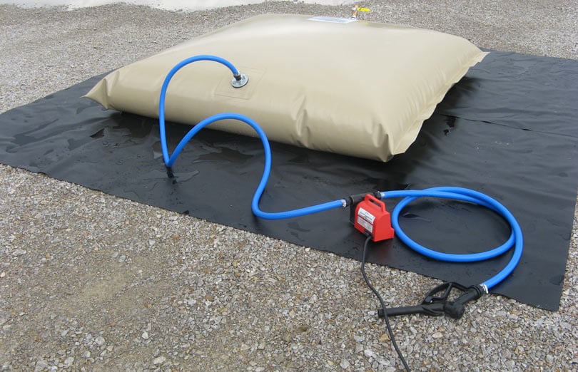 Ground cover with fuel bladder tank