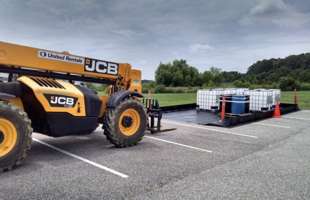 A Husky Patriot Berm in use on a work site