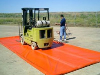 Washing construction equipment using Husky's berm with foam walls
