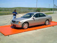 Car driving onto a foam wall berm