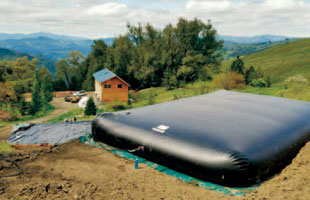 A bladder tank being used for water storage at a mountain cabin